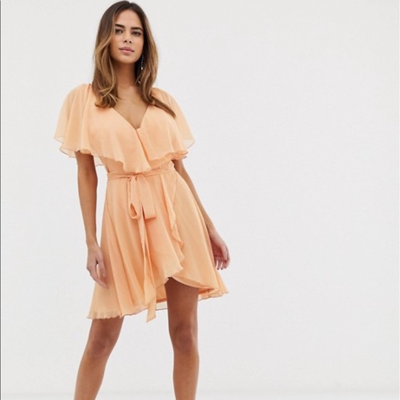cape back dipped hem dress